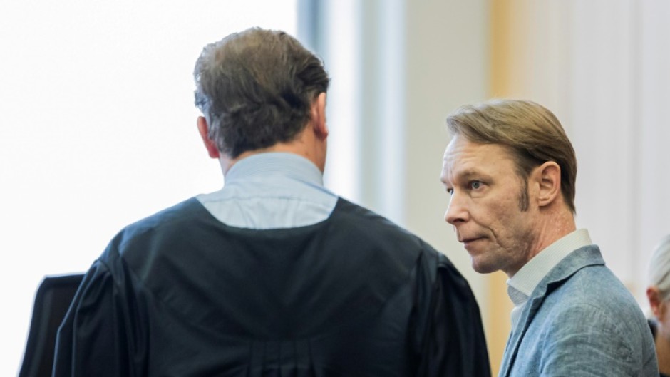 Christian Brueckner speaks to his lawyer Friedrich Fuelscher shortly before the verdict