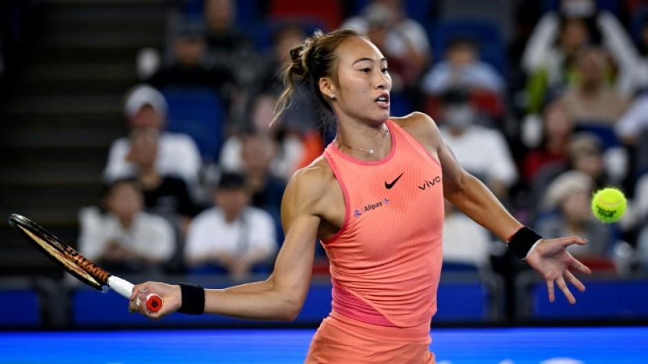 China's Zheng Qinwen hits a return to Italy's Jasmine Paolini during their women’s singles quater-final match at the Wuhan Open tennis tournament