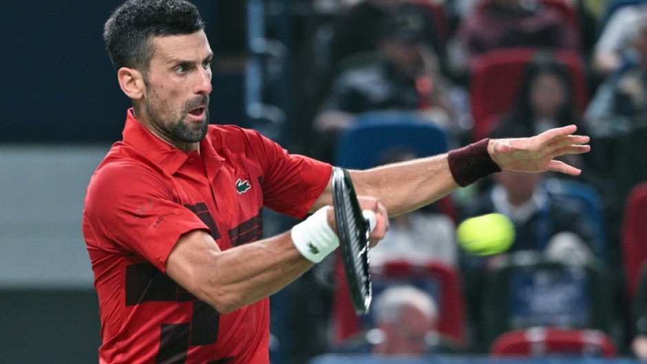 Serbia’s Novak Djokovic hits a return to Czech Republic’s Jakub Mensik during their men's singles match at the Shanghai Masters tennis tournament in Shanghai 