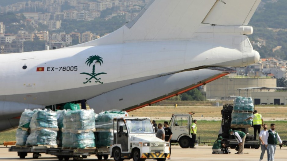 Aid provided for Lebanon by Saudi Arabia is unloaded on the tarmac at Beirut International Airport