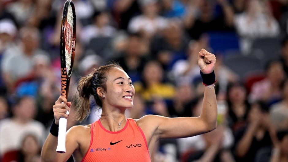 China's Zheng Qinwen celebrates after beating compatriot Wang Xinyu during their women's singles semi-final match at the Wuhan Open tennis tournament