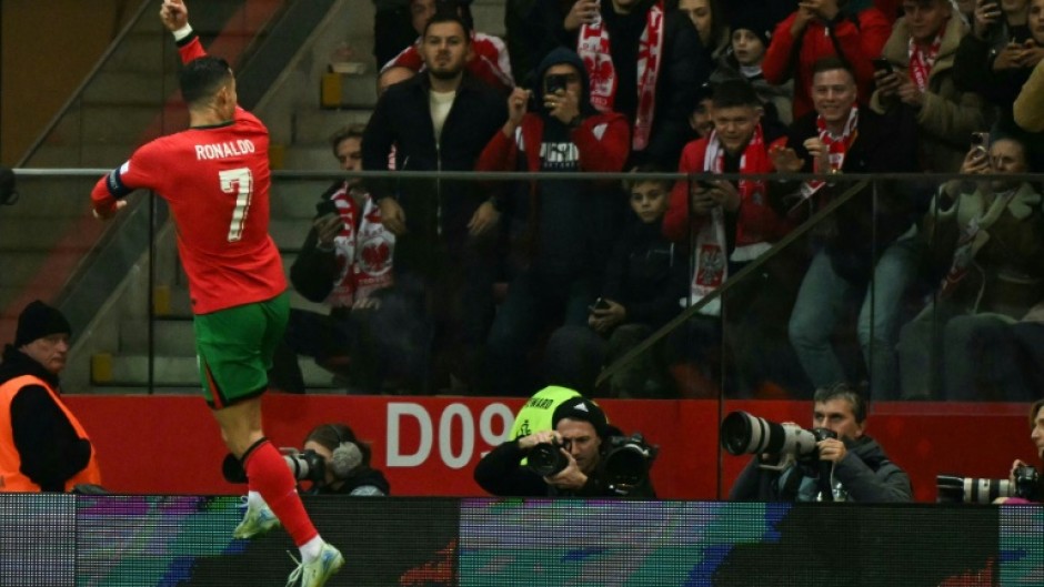 On target again: Cristiano Ronaldo celebrates scoring Portugal's second goal against Poland