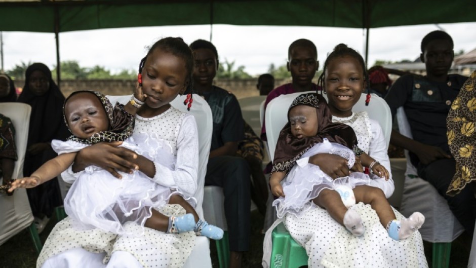 Hundreds of people gathered in the self-proclaimed 'twins capital of the world' to celebrate its unusually high rate of multiple births