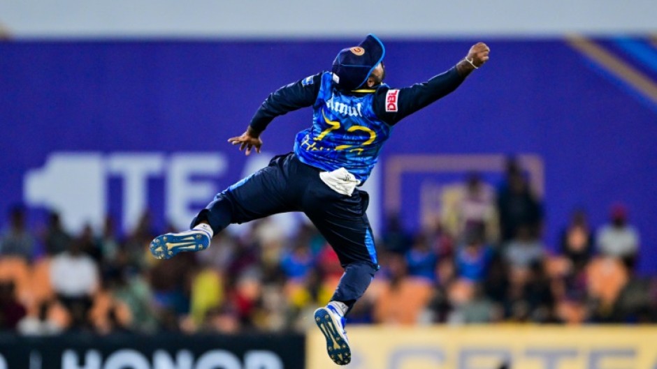 Sri Lanka's captain Charith Asalanka tries to stop the ball during the second T20 against the West Indies