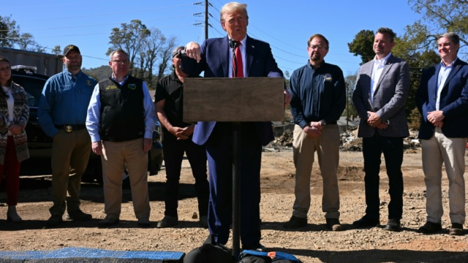 Former US President and Republican presidential candidate Donald Trump speaks to the media in Swannanoa, North Carolina, on October 21, 2024, after observing cleanup efforts in the aftermath of Hurricane Helene, which devastated the region 