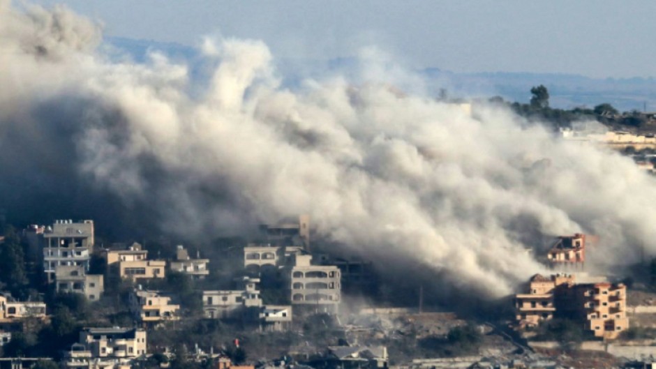 Smoke rises from the site of an Israeli air strike that targeted the southern Lebanese border village of Khiam 