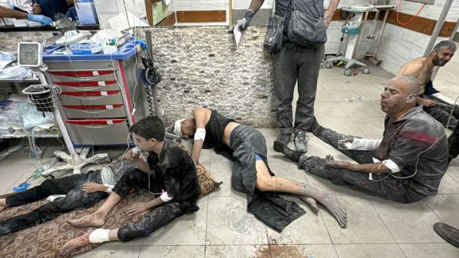 Wounded Palestinians receive treatment at Kamal Adwan Hospital after the Israeli air strike in Beit Lahia