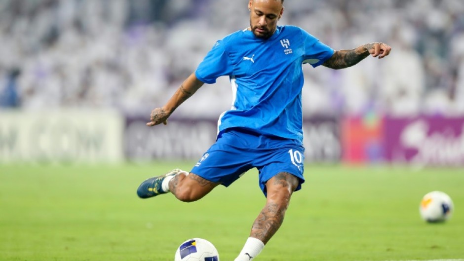 Neymar warms up ahead of his return