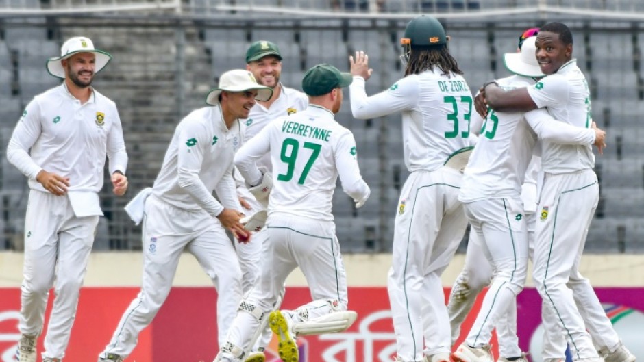 South Africa's Kagiso Rabada celebrates with teammates after taking a wicket