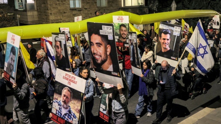 Protesters, calling for action to release hostages held in Gaza, march outside the Israeli Prime Minister's residence in central Jerusalem 