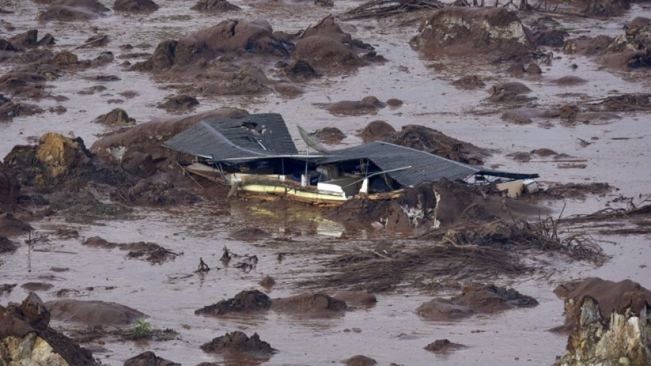 The dam collapse triggered a giant mudslide that swamped villages, rivers and rainforest, killing 19 people