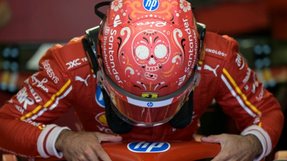 Ferrari's Spanish driver Carlos Sainz boards his car during the second practice session for the Formula One Mexico City Grand Prix