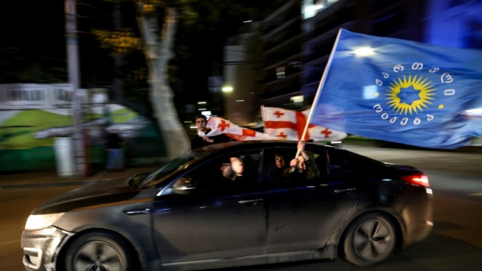 Georgia's ruling party declared victory in a result denounced by the opposition as fraudulent