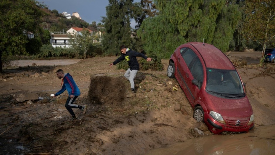 Emergency services rescued scores of people in Alora in Andalusia in southern Spain after a river overflowed.