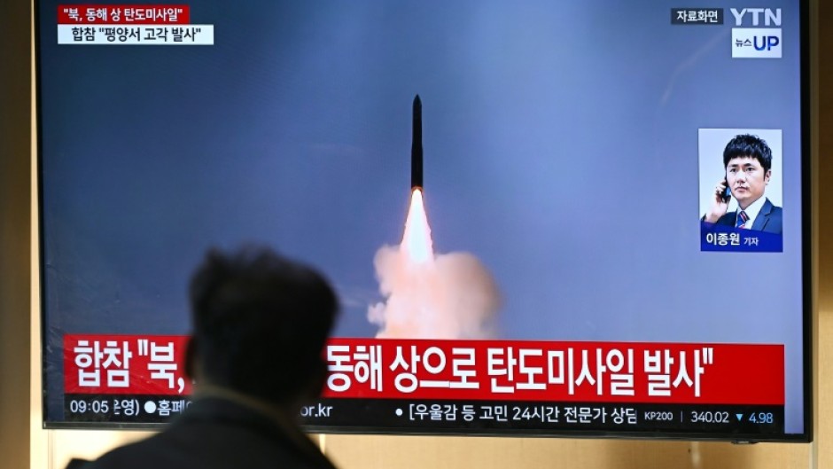 A man watches a a news broadcast with file footage of a North Korean missile test at a train station in Seoul on Thursday