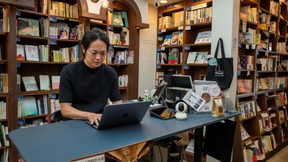 Rokurou Yui working at his bookstore in Tokyo