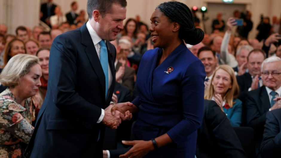 Kemi Badenoch (R) is congratulated by beaten candidate Robert Jenrick (L) after being announced as the new leader of the UK's Conservative Party