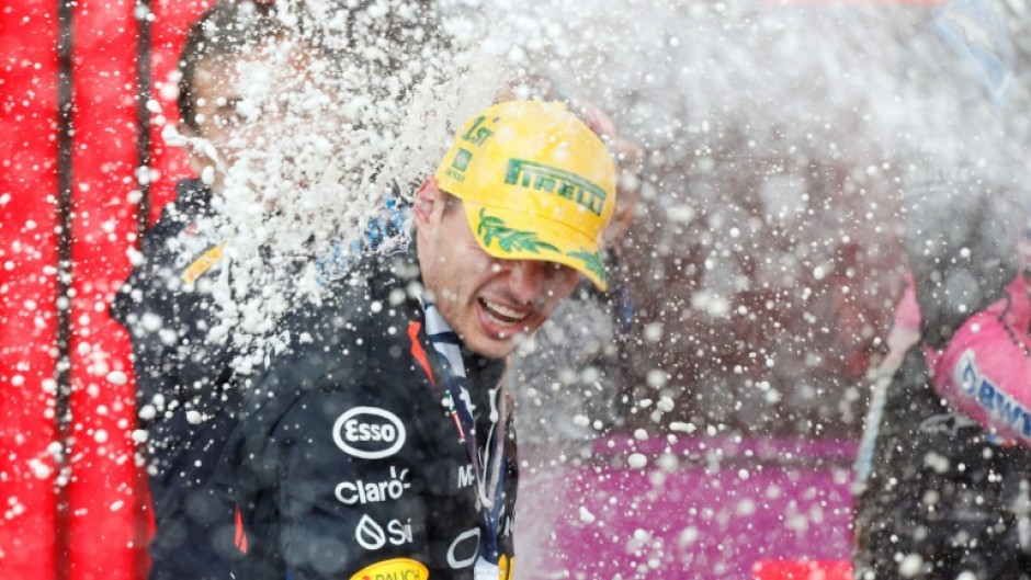 Champagne moment: Max Verstappen celebrates victory on the podium