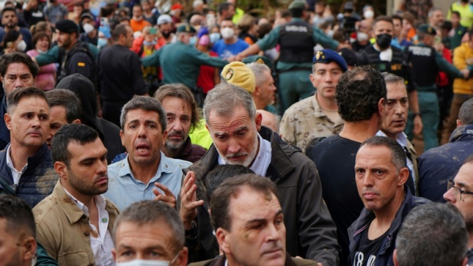 King Felipe VI of Spain was pelted with mud while trying to calm the crowd