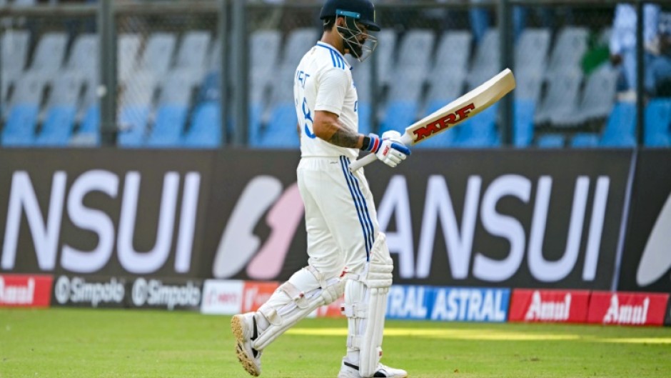 India's Virat Kohli walks back to the pavilion after his dismissal in the third Test