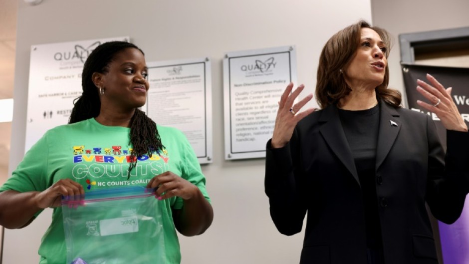 Kamala Harris (R), seen here at a Charlotte health clinic preparing aid for victims of Hurricane Helene, sees North Carolina as a winnable prize, pouring huge resources into the battleground state ahead of the November 5, 2024 presidential election