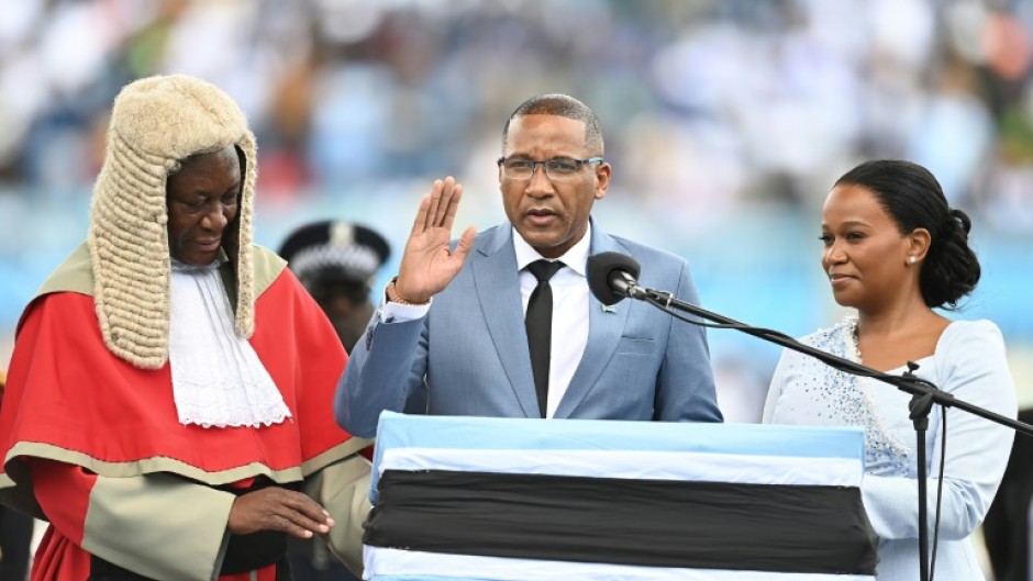 Botswana’s new president Duma Boko (C) was sworn in, a week after his landslide election victory