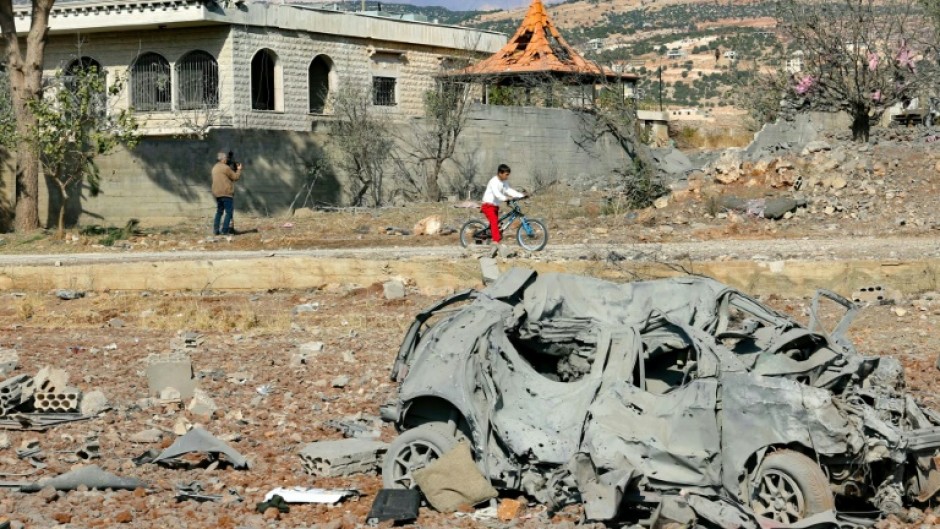 A destroyed car lies among debris a day after Israeli air strikes targeted the Lebanese village of Knaisseh near Baalbek, in Lebanon's eastern Bekaa Valley