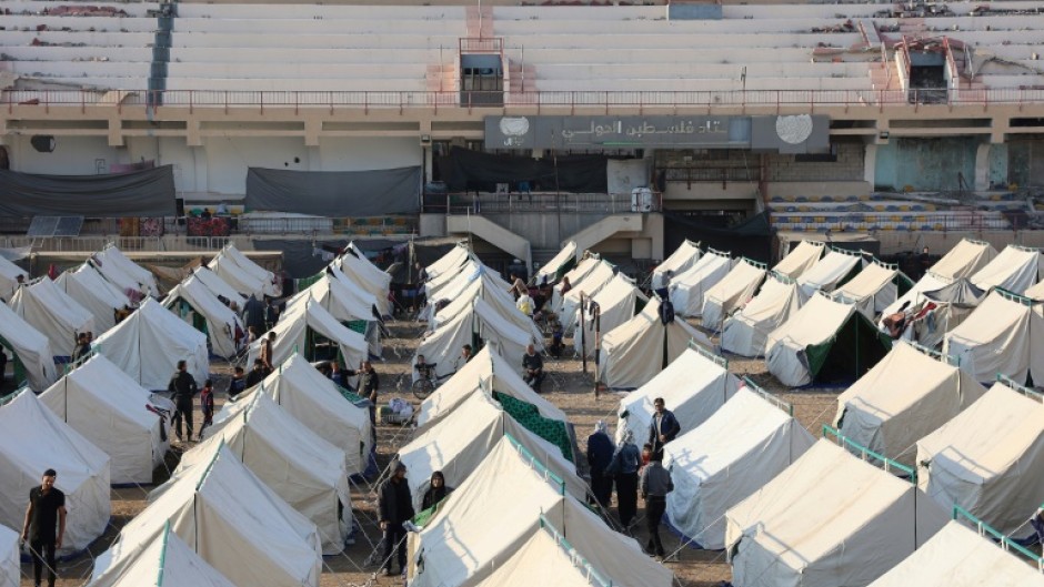 Palestinians displaced by the ongoing war in Gaza shelter in tents at Palestine Stadium in Gaza City, in the territory's north