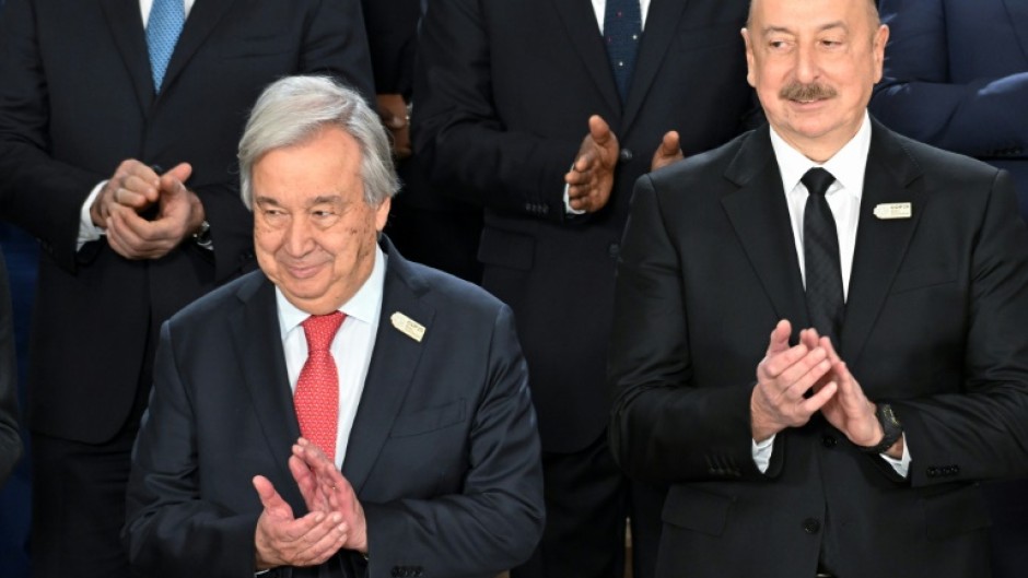 United Nations (UN) Secretary General Antonio Guterres and Azerbaijan's President Ilham Aliyev attend a family photo at COP29 