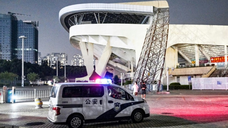 A police car is seen at the Zhuhai Sports Centre on November 12, 2024, a day after a car rammed through the site killing dozens 