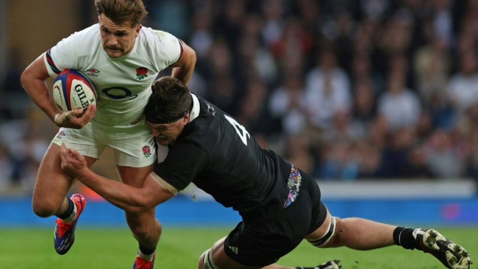 England's Henry Slade in action against New Zealand