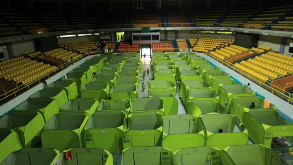 Residents from coastal areas take shelter in an evacuation centre in Legaspi city, south of Manila