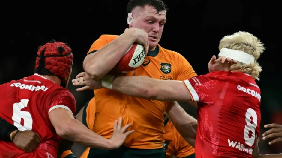 Australia prop Angus Bell is tackled by James Botham and  Aaron Wainwright 