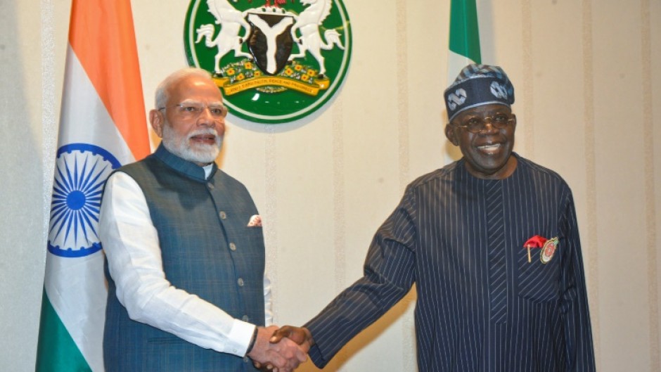 India's Prime Minister Narendra Modi (L) and Nigeria's President Bola Tinubu (R) are psuhing for greater global roles for their countries, respectively, the most populous in the world and the most populous in Africa