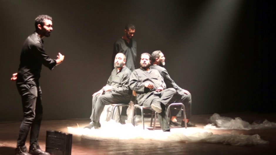 Actors perform on stage during the sixth edition of the Derna Festival, back after a pause due to the 2023 floods