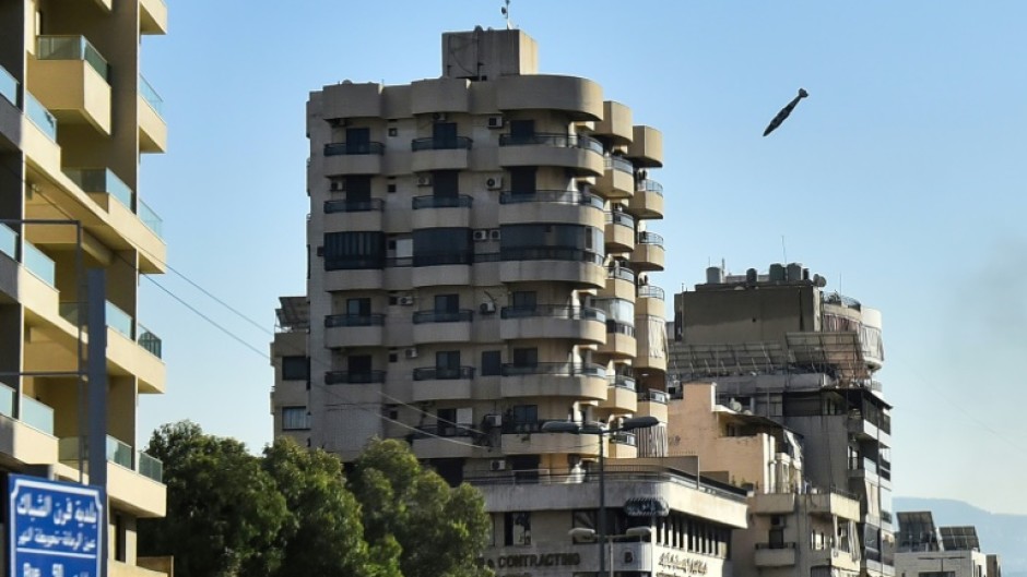 An Israeli missile is about to hit a building in Beirut's southern Shiyah neighbourhood, sparking a fireball and collapsing the structure onto itself