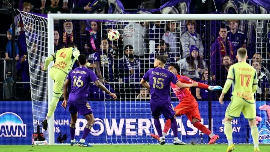 Andres Reyes heads in the winner as the New York Red Bulls beat Orlando City to reach the MLS Cup final.