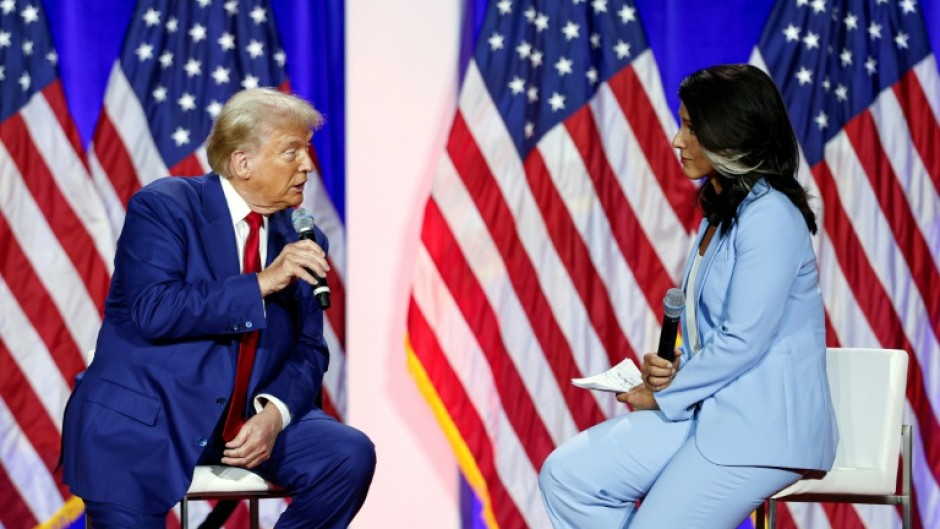 Former US congresswoman Tulsi Gabbard -- pictured with Donald Trump in Wisconsin during the election campaign -- is another of the president-elect's controversial nominees