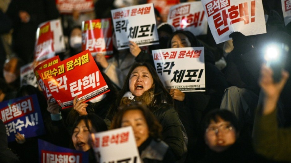 People take part in a protest calling for the resignation of South Korean President Yoon Suk Yeol in Seoul