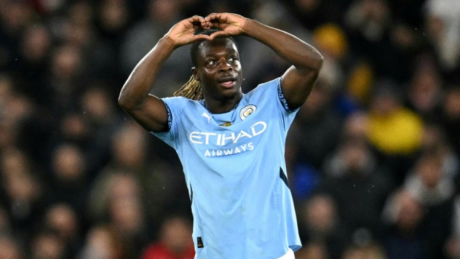 Jeremy Doku celebrates scoring Manchester City's third goal against Nottingham Forest