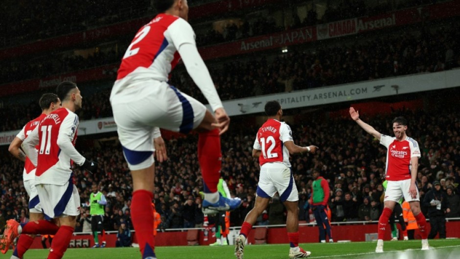 Arsenal celebrate Jurrien Timber's goal against Manchester United