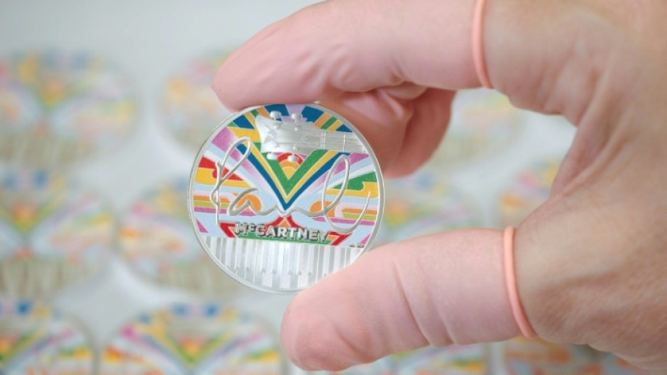 The coin's design includes the psychedelic 'magic piano' featured in the 1967 Magical Mystery Tour film