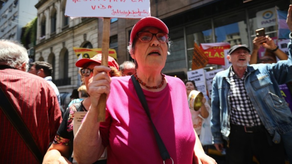 Alicia Ceresoli, an 80-year-old pensioner, protests outside the headquarters of PAMI, the agency that manages retiree benefits, in Buenos Aires on December 4, 2024