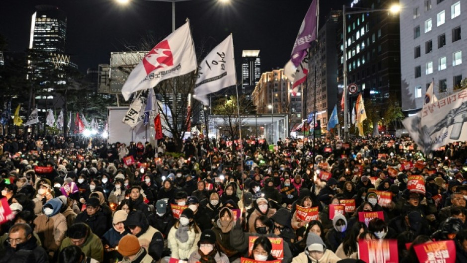 On Friday night, at least 15,000 anti-Yoon protesters braved the cold weather to gather outside the National Assembly 