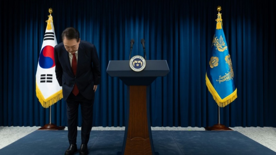 South Korean President Yoon Suk Yeol bows after apologising for his declaration of martial law in a nationally televised speech