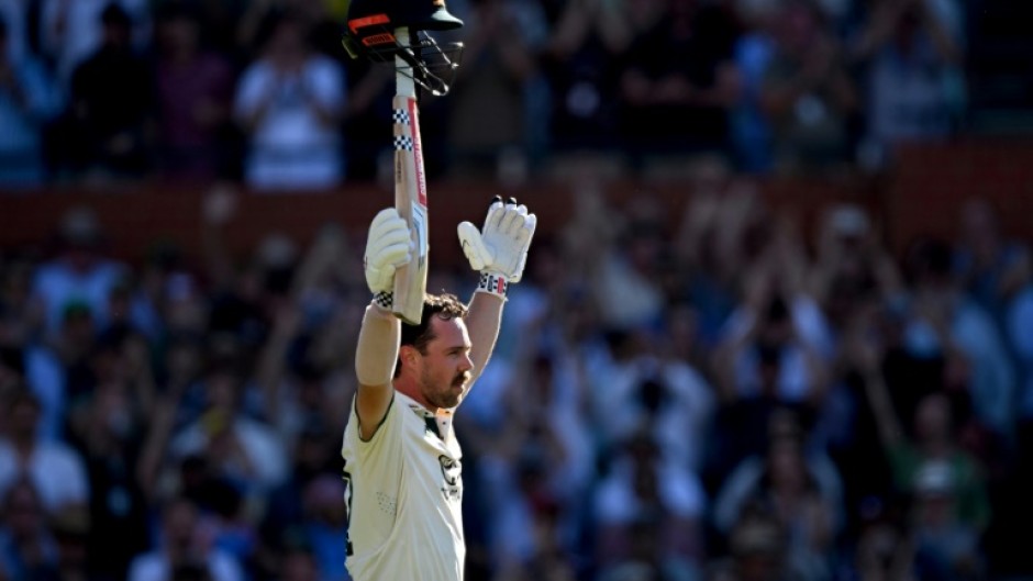 Australia's Travis Head celebrates after scoring a century on the second day of the second Test against India