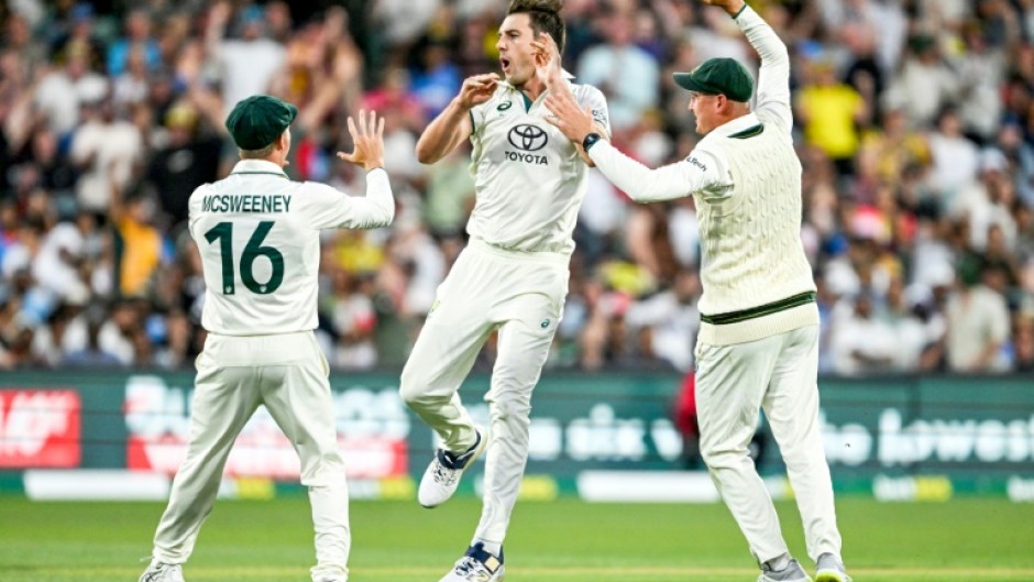 Australian captain Pat Cummins (C) celebrates after taking the wicket of India's KL Rahul