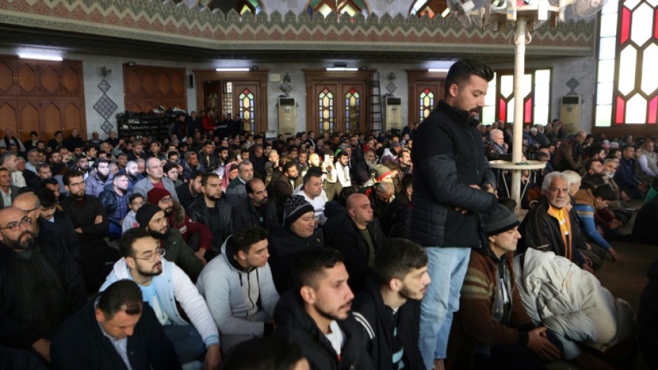 Syrian Muslims pray at a mosque in the northern city of Aleppo after its capture by Islamist-led rebels