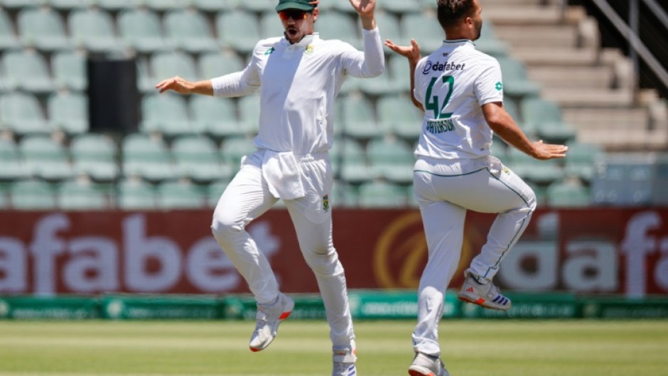 Dane Paterson (R) celebrates after the dismissing Sri Lanka's Dhananjaya de Silva 