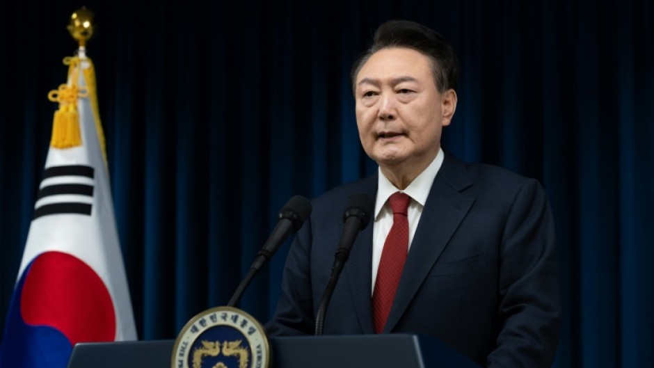 South Korean President Yoon Suk Yeol's future remained uncertain Sunday after surviving an impeachment vote over his brief imposition of martial law